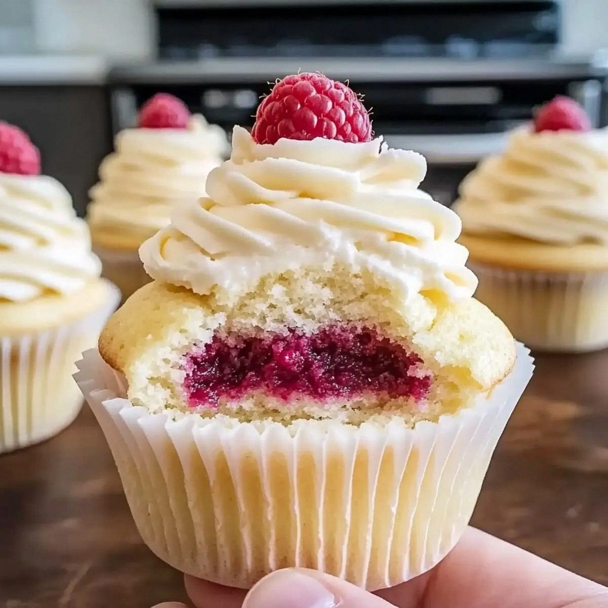 Almond Wedding Cake Cupcakes with Raspberry Filling Bliss