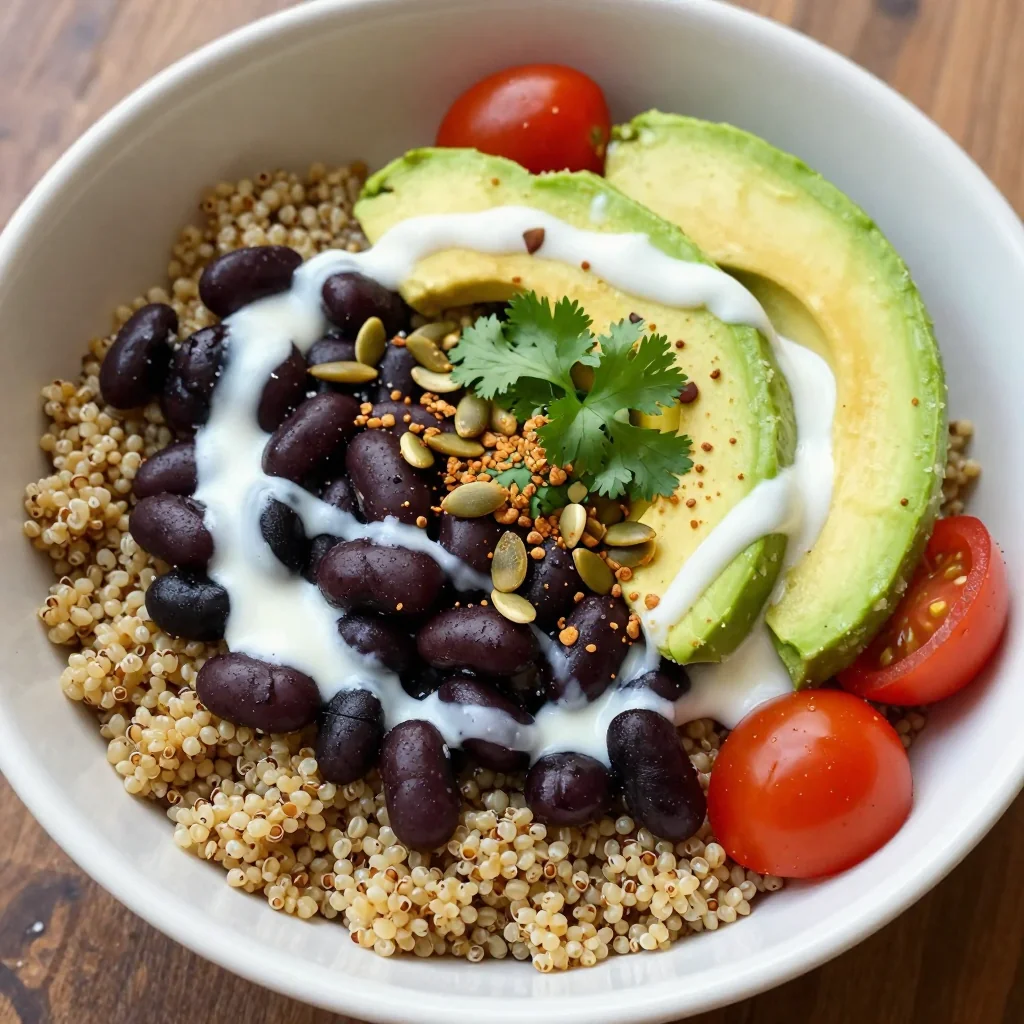 Hearty Black Bean Quinoa Bowl With Lime Crema